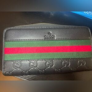 **Damaged Zip Wallet: Inside Zipper tab fell off, Some tarnish on outside zip**